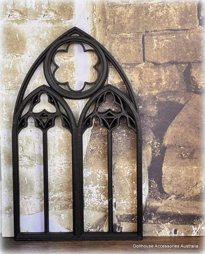 Dollhouse Decorative gothic window frame against a stone wall background