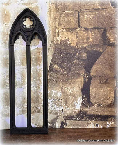 Dollhouse Black gothic-style mirror against a stone wall background