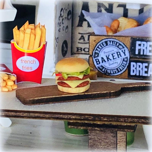 Dollhouse burger on wooden board slider