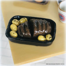 Dollhouse miniature roast beef in pan with potatoes