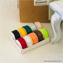 Dollhouse miniature box of ribbon rolls