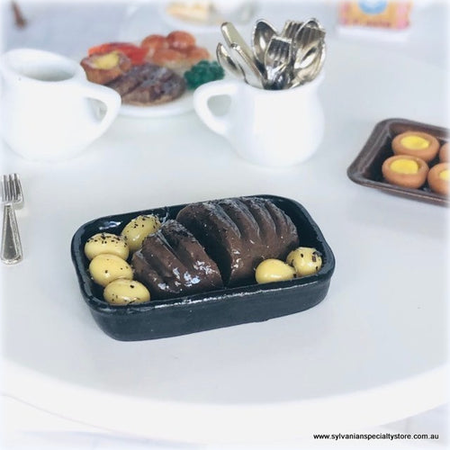Dollhouse miniature roast beef in pan with potatoes