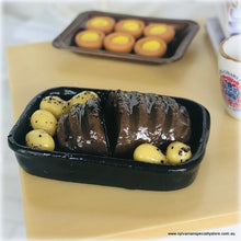 Dollhouse miniature roast beef in pan with potatoes