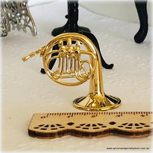 Dollhouse miniature french horn musical instrument