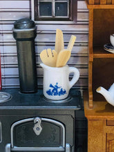 Miniature delft jug with wooden spoon etc