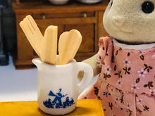 Blue jug with wooden utensils