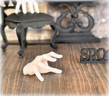 dollhouse halloween creepy hand Addams Family spooky