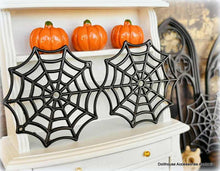 Dollhouse Miniature Halloween decorations  spider webs and on a shelf.