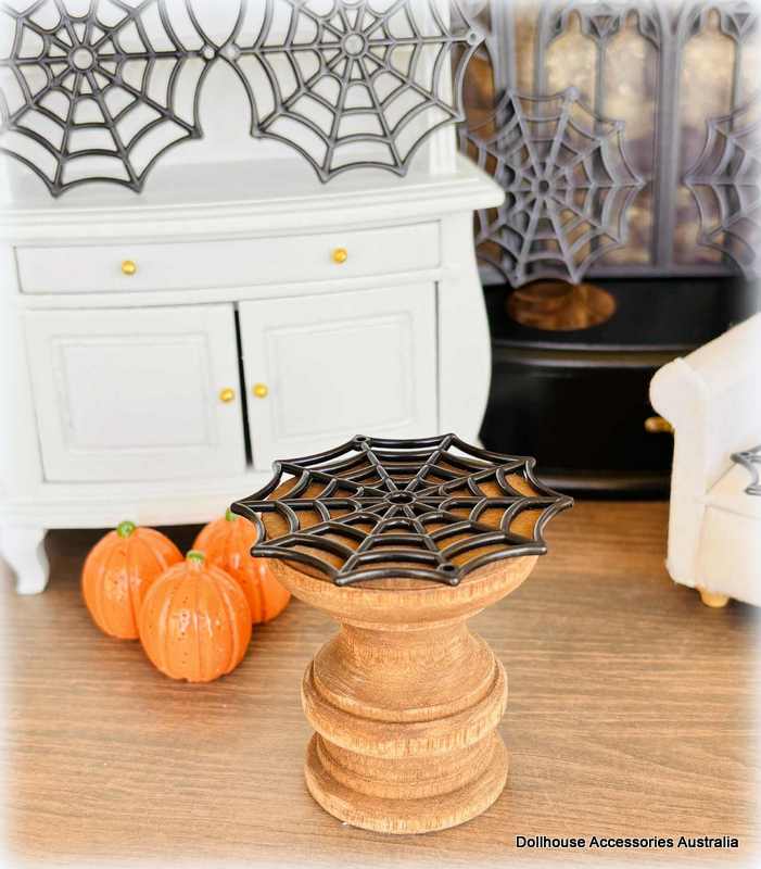 Dollhouse Miniature Halloween decorations  spider webs and on a shelf.