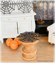 Dollhouse Miniature Halloween decorations  spider webs and on a shelf.