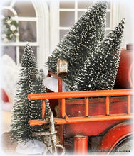 Dollhouse Decorative scene with bottlebrush trees and a red truck in a home setting