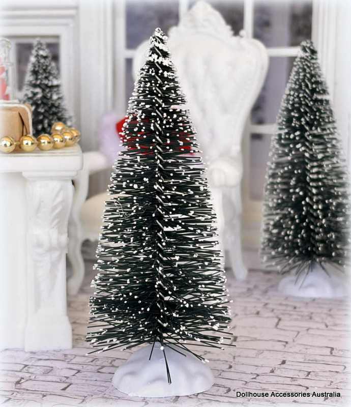 Dollhouse miniature Decorative Christmas trees with snow-like texture in a dollhouse setting.