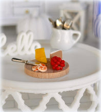Dollhouse cheese board with knife and grapes