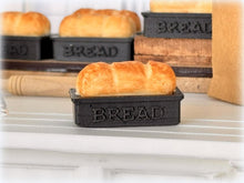 Dollhouse fresh loaf bread out of oven in baking pan