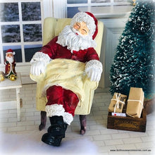 Dollhouse miniature Santa sleeping in armchair