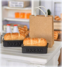 Dollhouse fresh loaf bread out of oven in baking pan