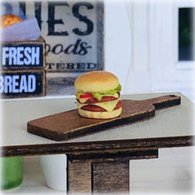 Dollhouse burger on wooden board slider 