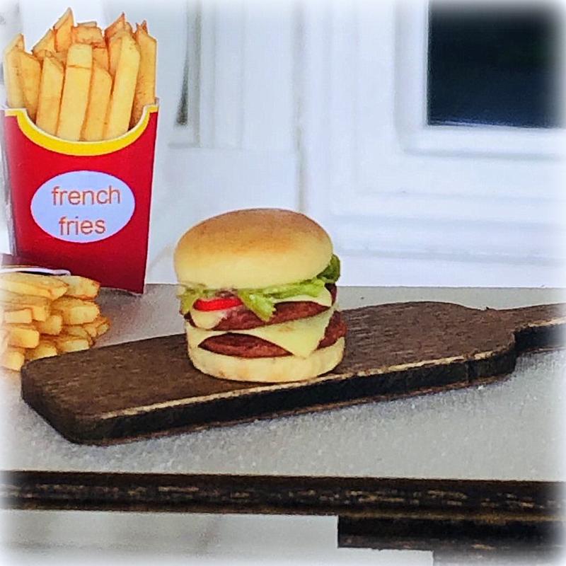 Dollhouse burger on wooden board slider 