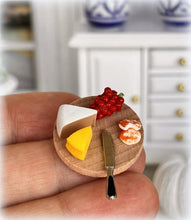 Dollhouse cheese board with knife and grapes