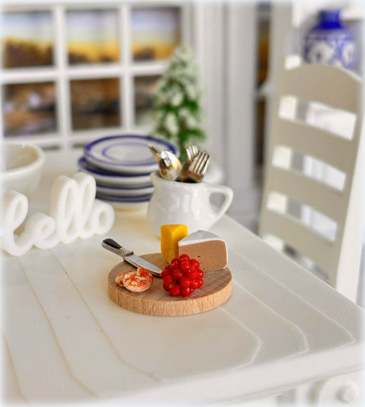 Dollhouse cheese board with knife and grapes