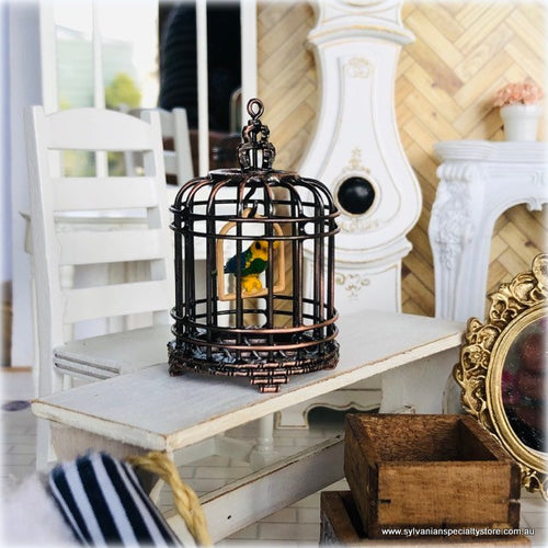 Dollhouse birdcage with bird