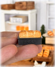 Dollhouse fresh loaf bread out of oven in baking pan