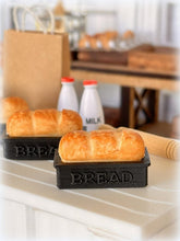 Dollhouse fresh loaf bread out of oven in baking pan