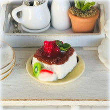 Dollhouse dessert panna cotta with raspberry coulis