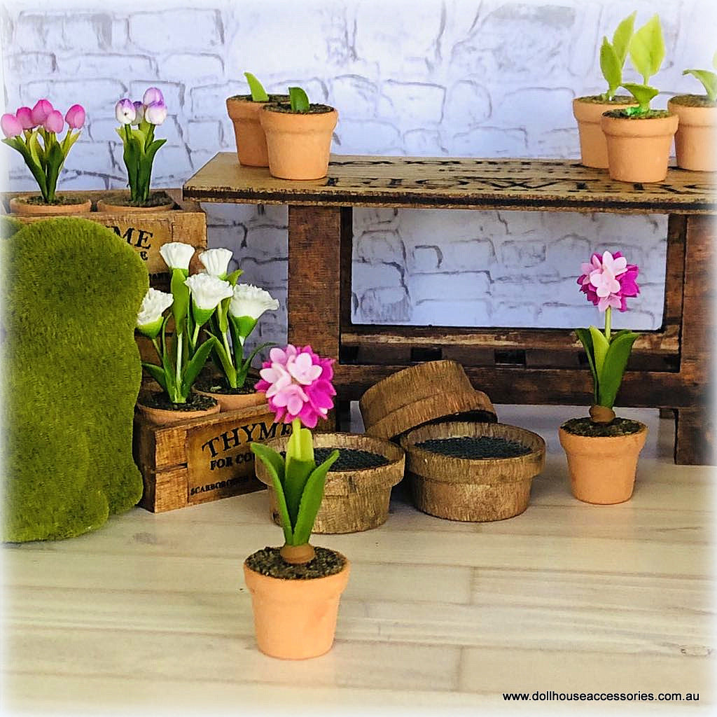 Dollhouse minaiture pink hyacinth flower in pot
