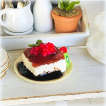 Dollhouse dessert panna cotta with raspberry coulis