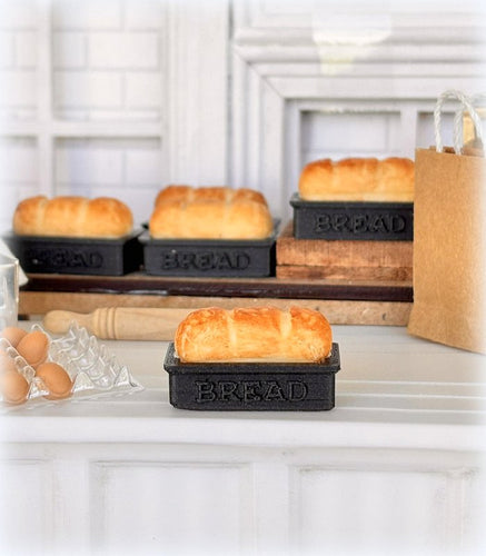 Dollhouse fresh loaf bread out of oven in baking pan