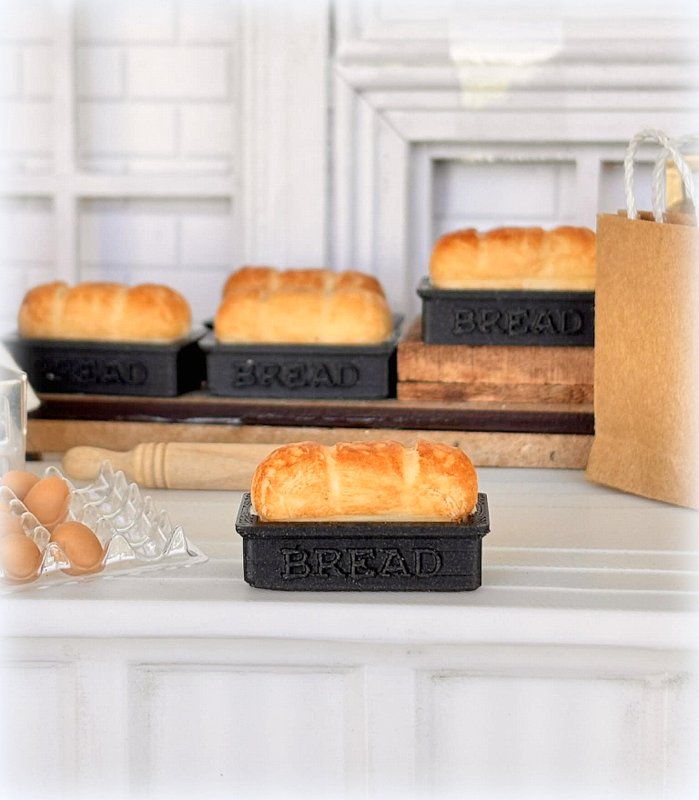 Dollhouse fresh loaf bread out of oven in baking pan