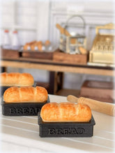Dollhouse fresh loaf bread out of oven in baking pan