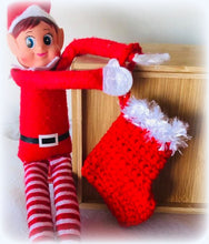 Christmas naughty elf hanging his stocking