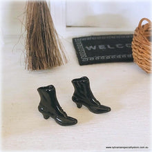 Dollhouse black pair of boots