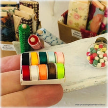 Dollhouse miniature box of ribbon rolls