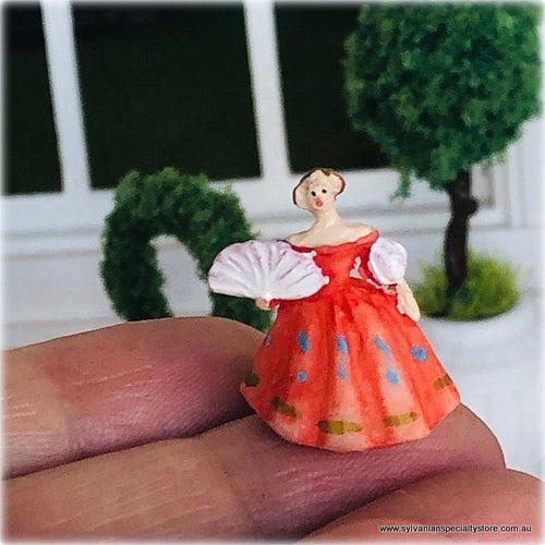 Dollhouse ornament figurine lady in orange