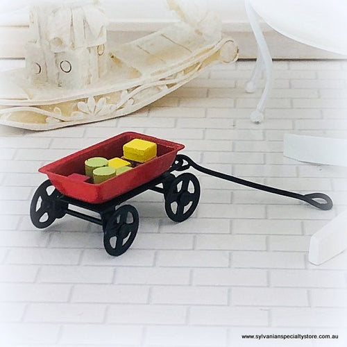 Dollhouse miniature red trolley with blocks
