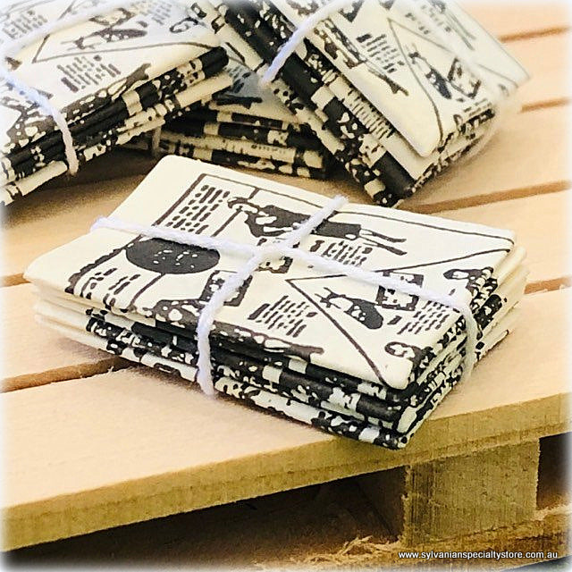 Newspapers Tied with String - Miniature