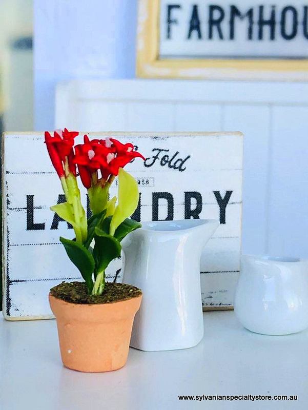 Dollhouse miniature red flowers in pot