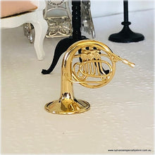 Dollhouse miniature french horn musical instrument