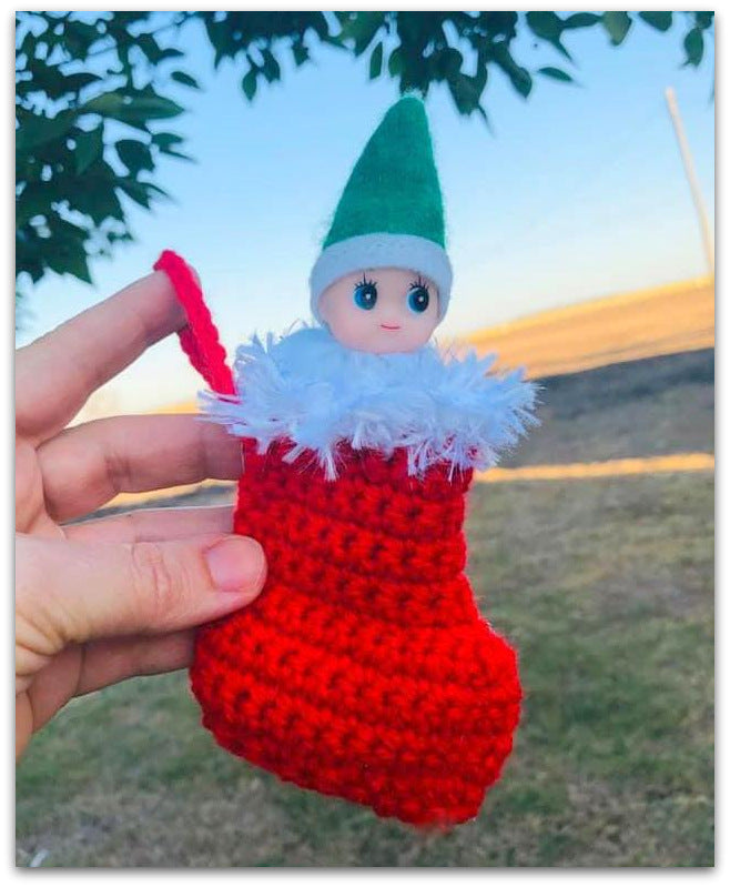 Elf baby in Christmas stocking
