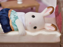 Sylvanian Families Stella rabbit asleep on single bed