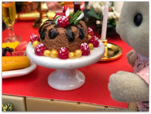 Dollshouse miniature sweet treat on cake pedestal